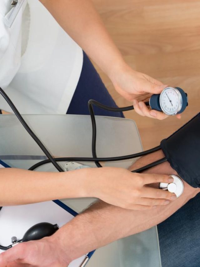 bird-s-eye-view-of-female-nurse-measuring-male-patient-s-blood-pressure