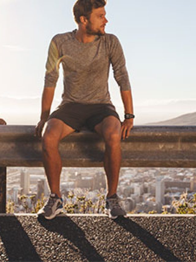 man-sitting-on-rail-600x300