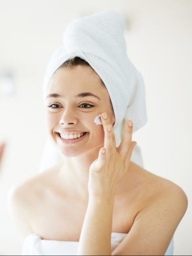 woman-putting-on-face-cream