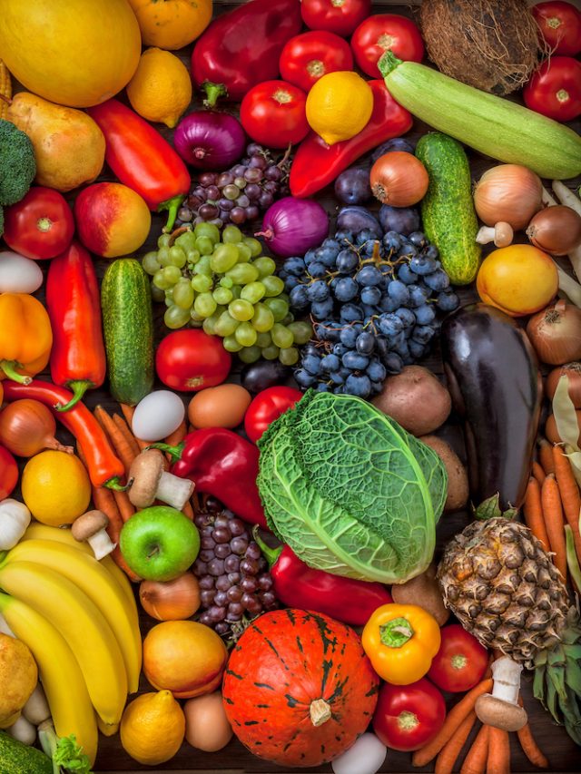 Vegetables and fruits large overhead mix group on colorful background