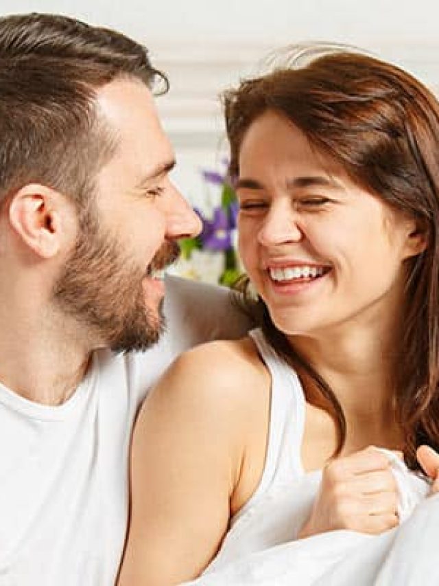 young-adult-heterosexual-couple-lying-bed-bedroom