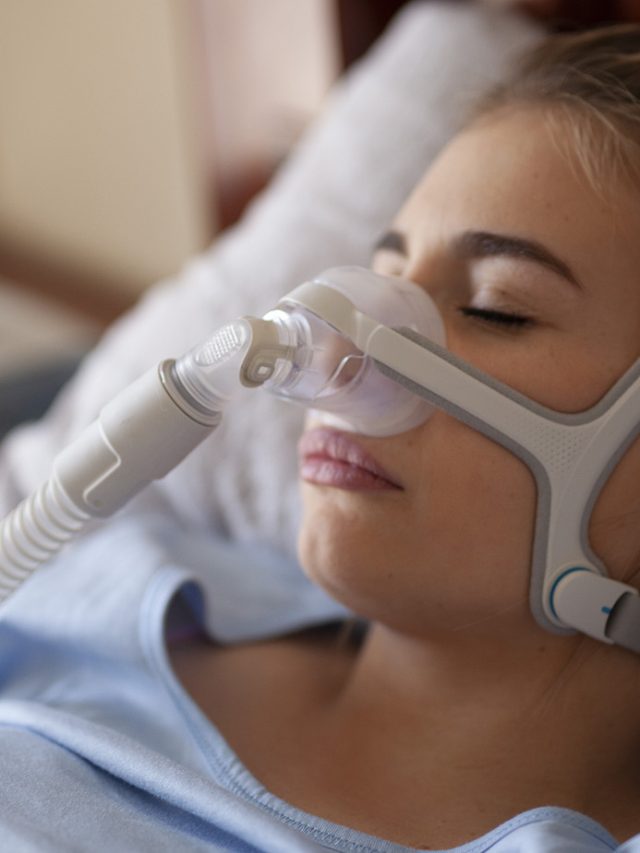 young-woman-in-bed-cpap-machine